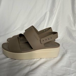 Tan platform Crocs sandals